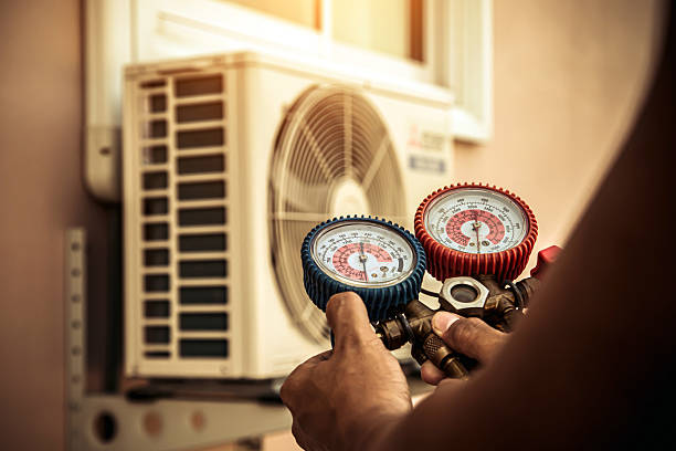 Professional Air Conditioning Service technician working in Alburtis, PA